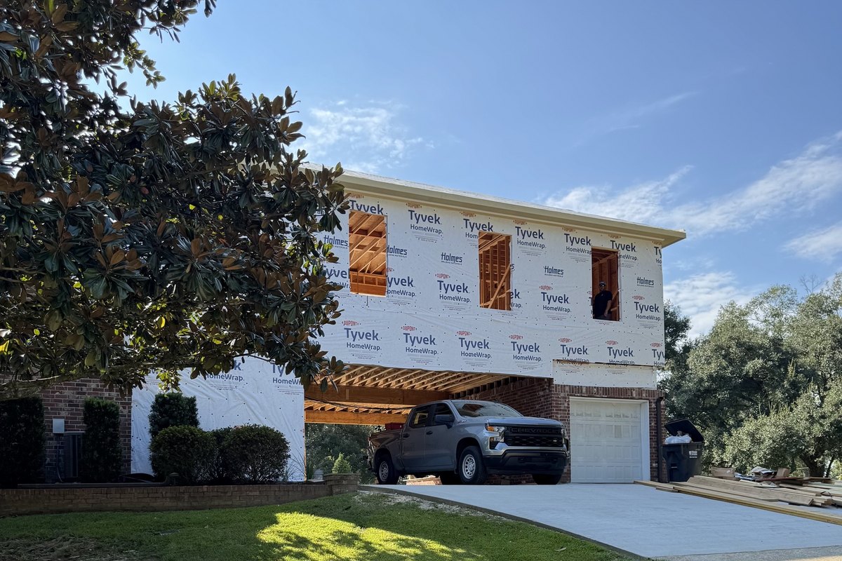 Second-story addition built over a brick home's garage