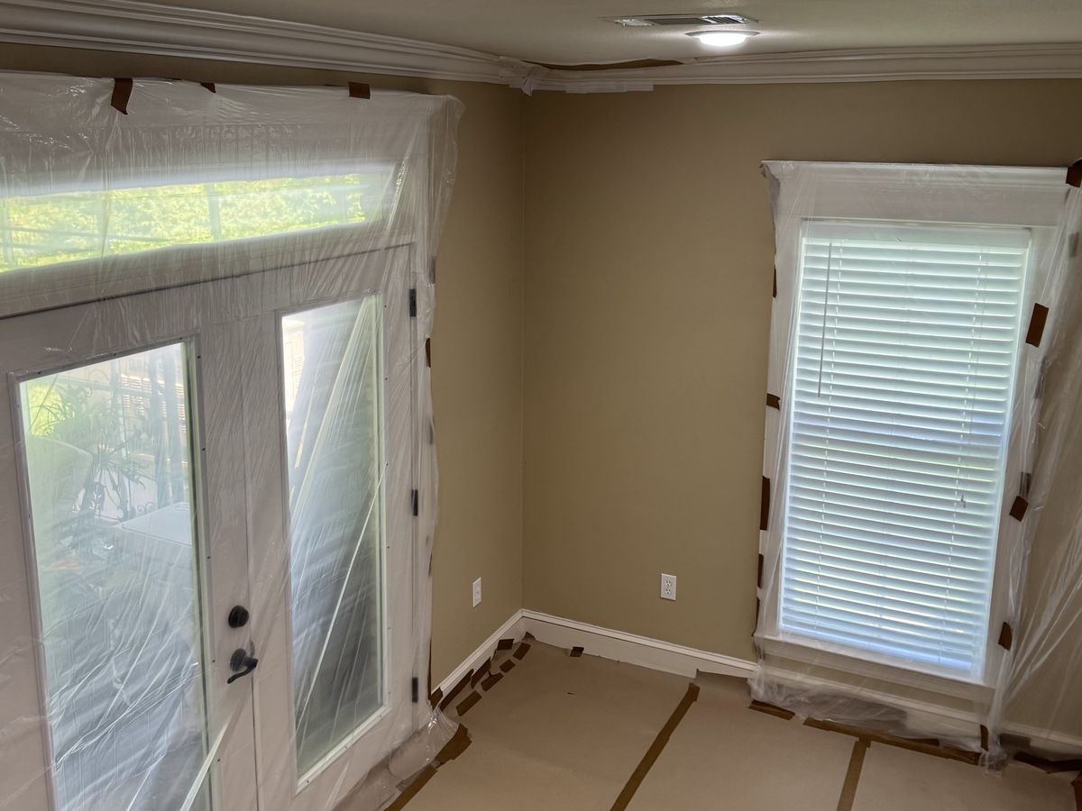 French doors and transom covered in plastic before painting