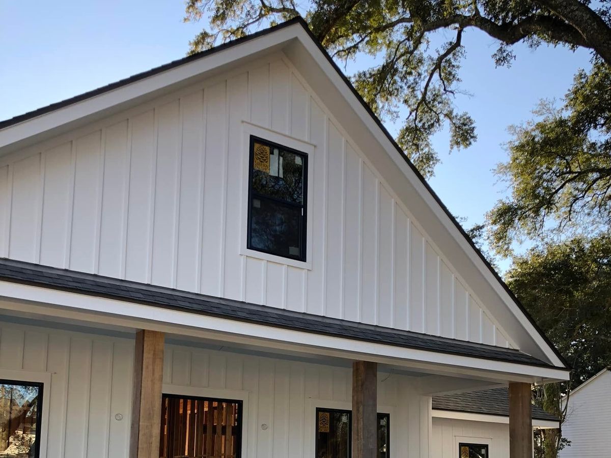 New farmhouse-style home with white board-and-batten walls