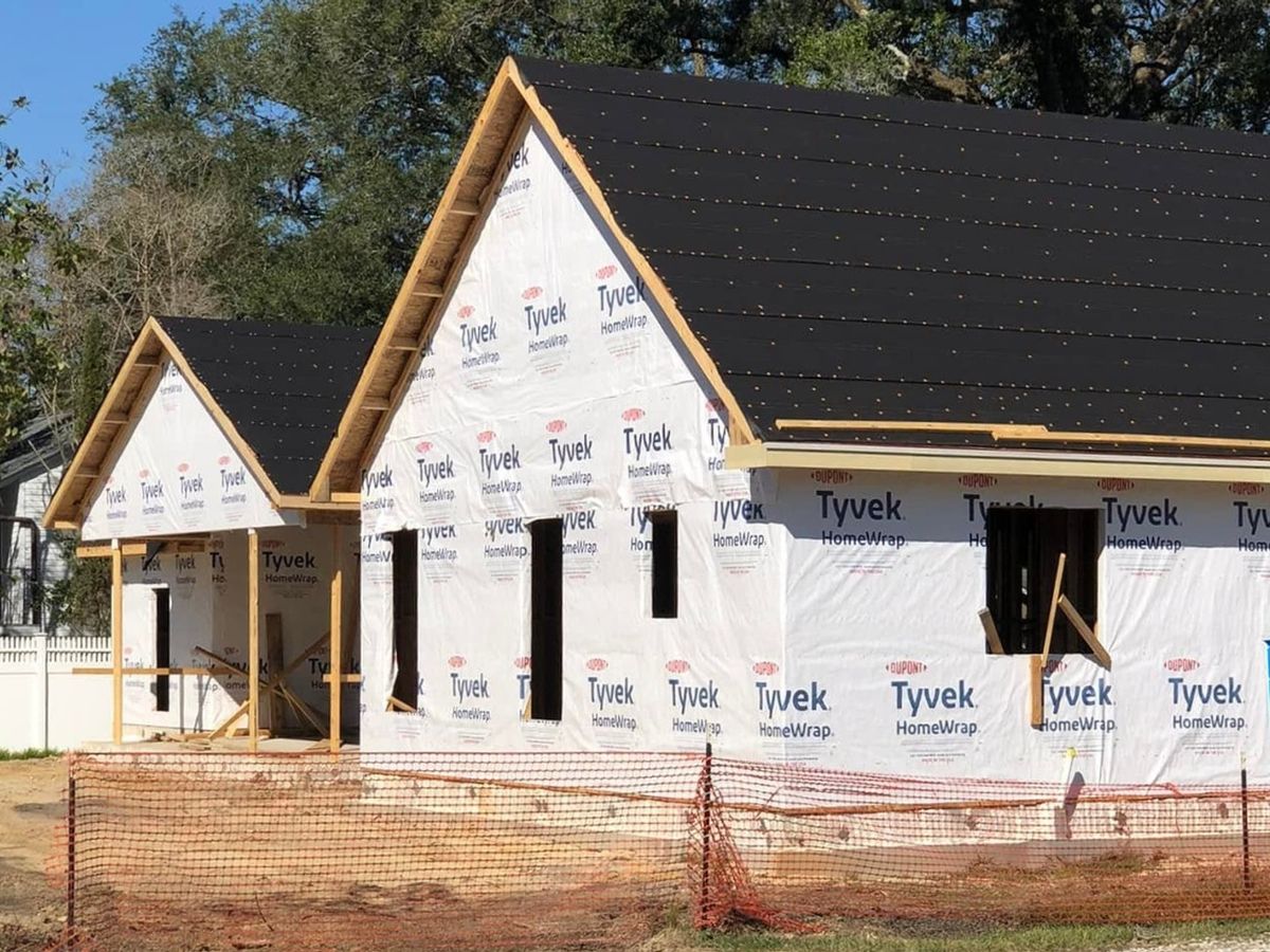 New house with two front gables in house wrap and black underlayment