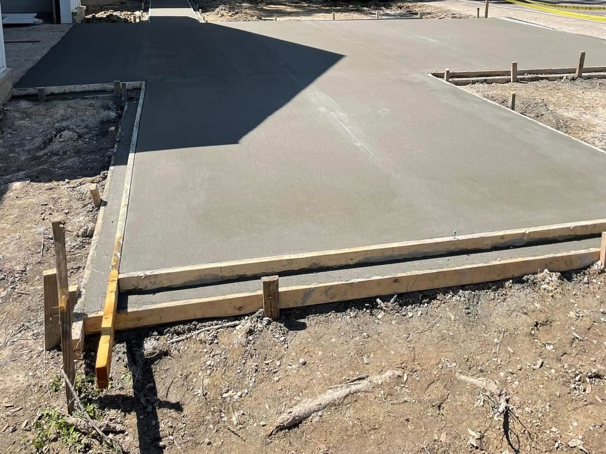 Wet concrete slab inside wood forms on a new build