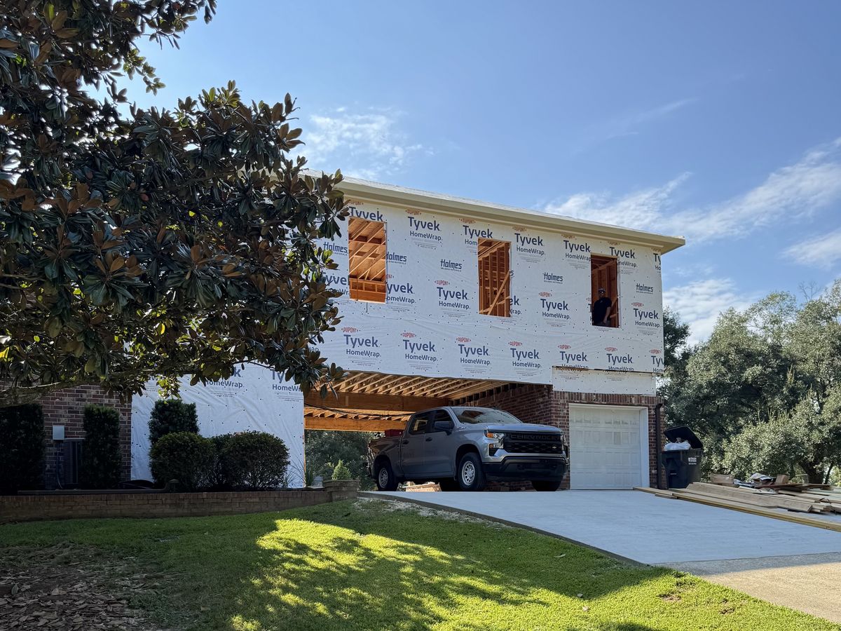 Second-story addition built over a brick home's garage