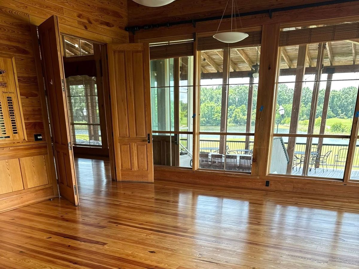 Amber heart pine floor by doors to a screened porch