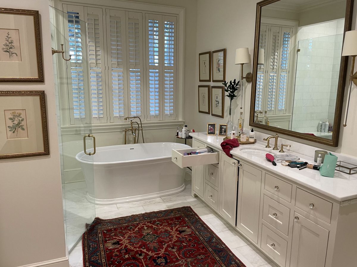 Remodeled primary bathroom with a freestanding soaking tub