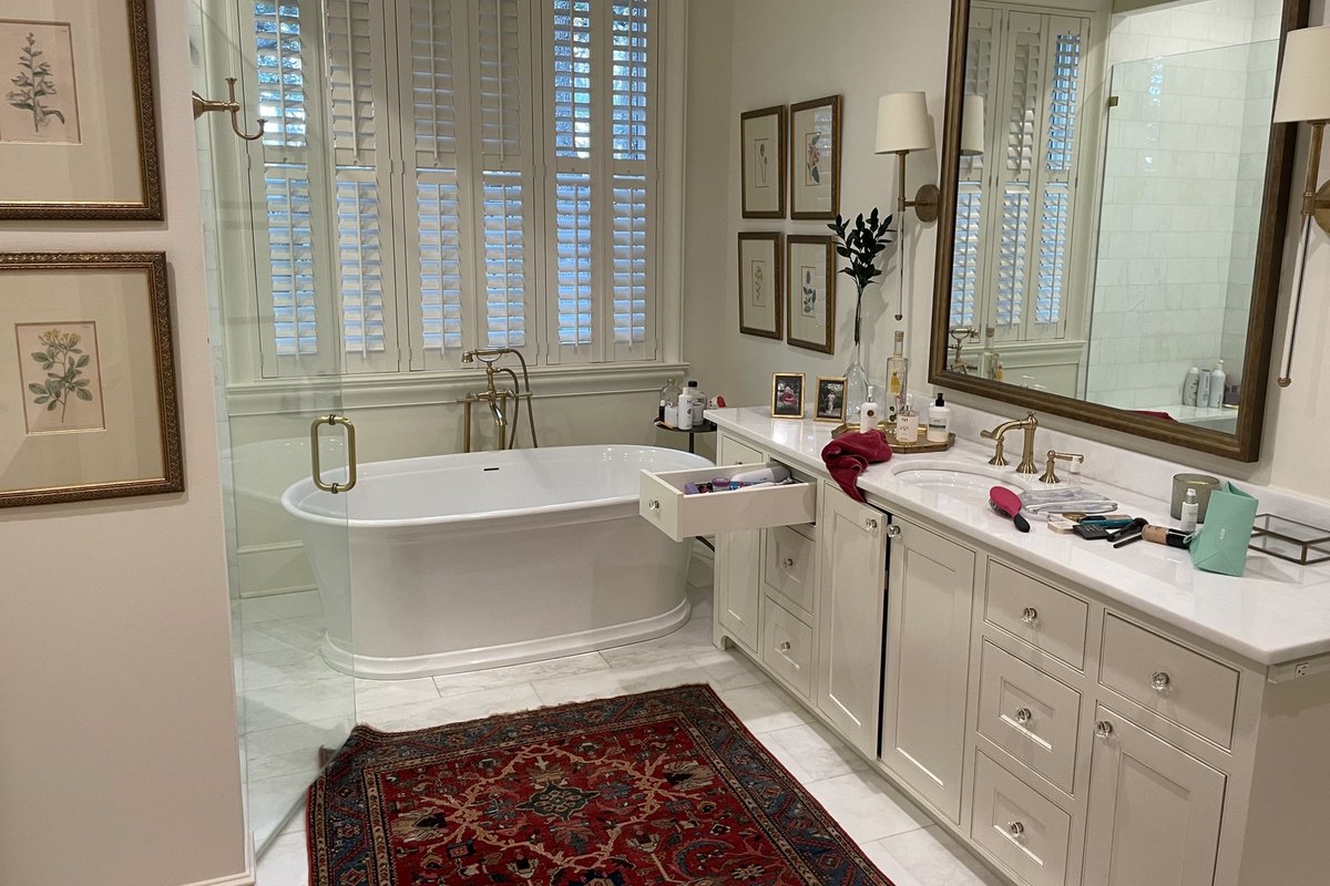 Remodeled primary bathroom with a freestanding soaking tub