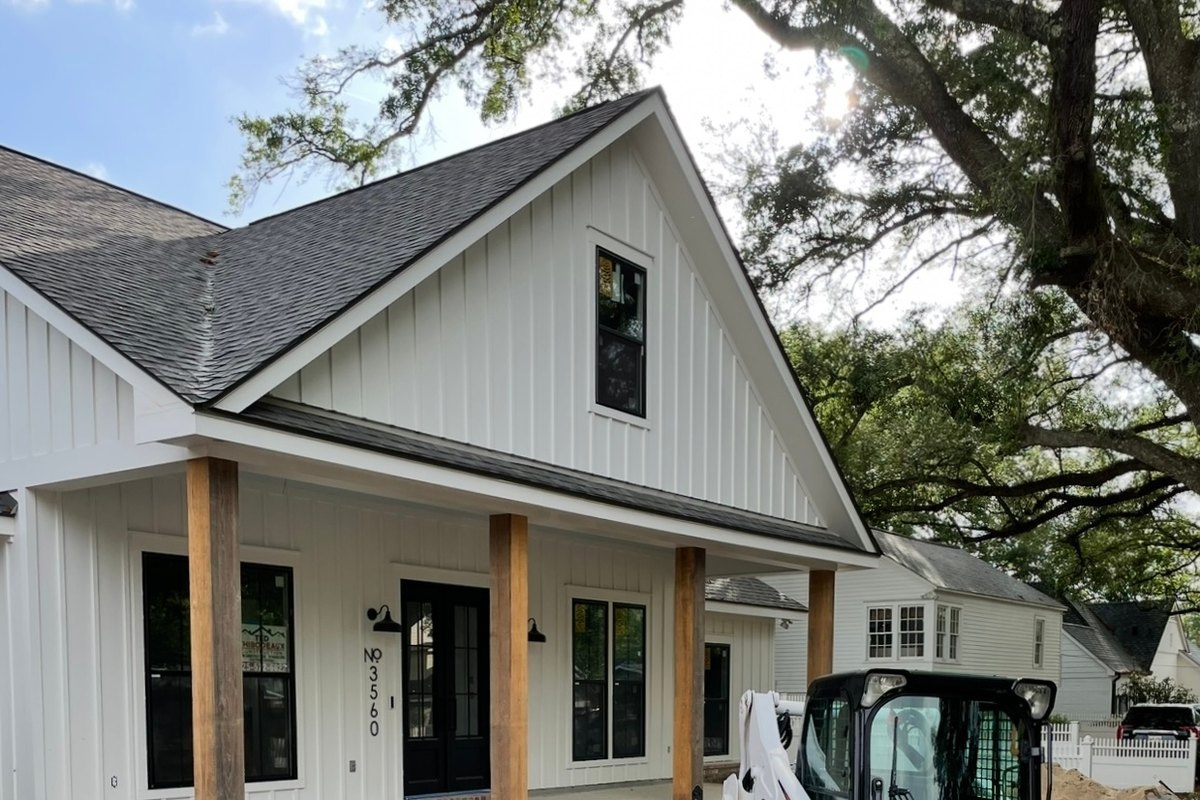 White board-and-batten farmhouse nearly finished