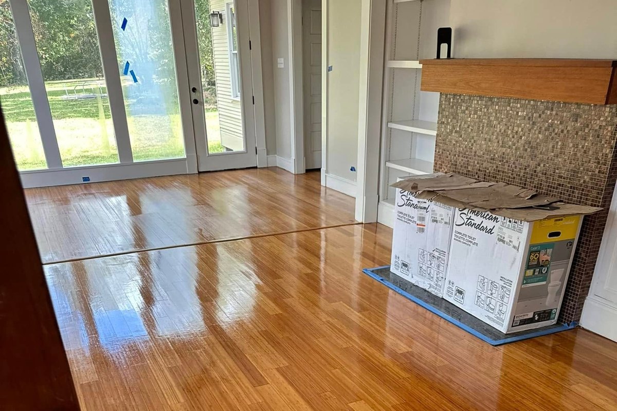 Room with a refinished light amber floor in high gloss