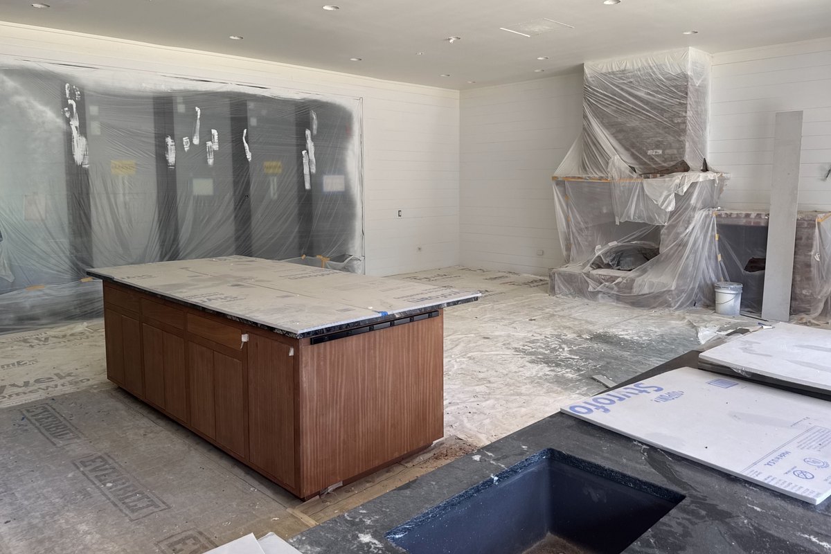 Large kitchen and living room mid-renovation