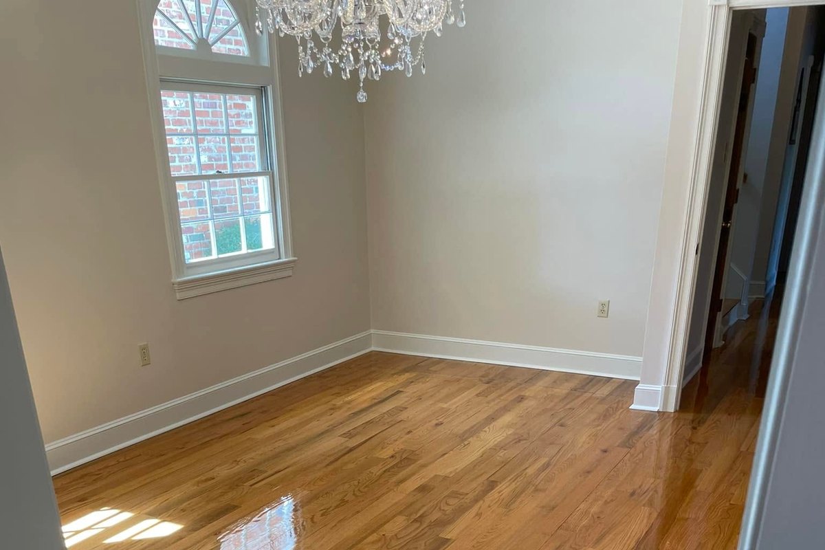 Bedroom floor of high-gloss refinished red oak