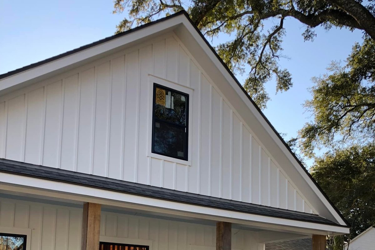 New farmhouse-style home with white board-and-batten walls