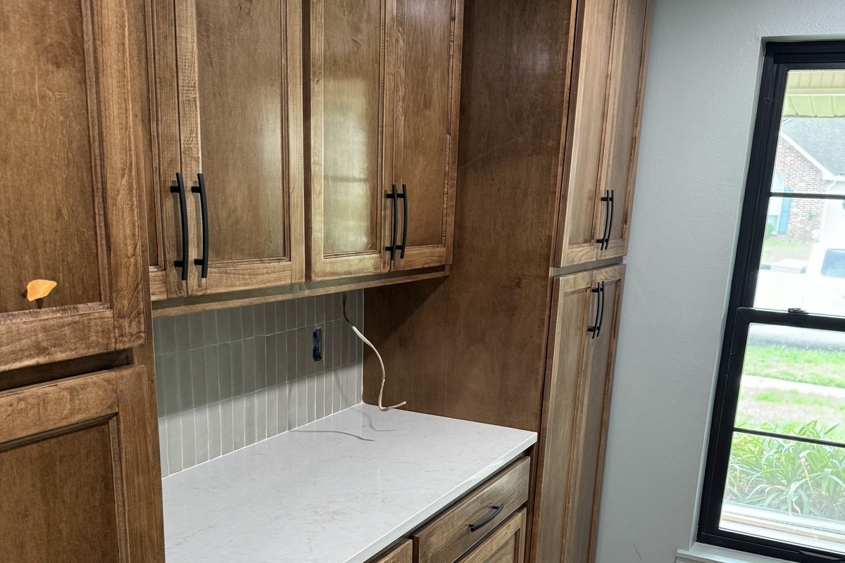Coffee bar with a white quartz counter and gray tile