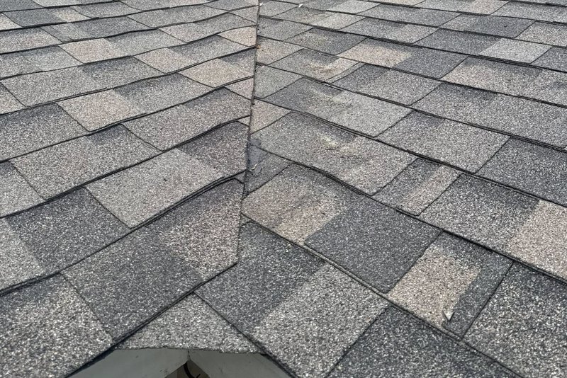 Close view of a roof valley in weathered-gray shingles