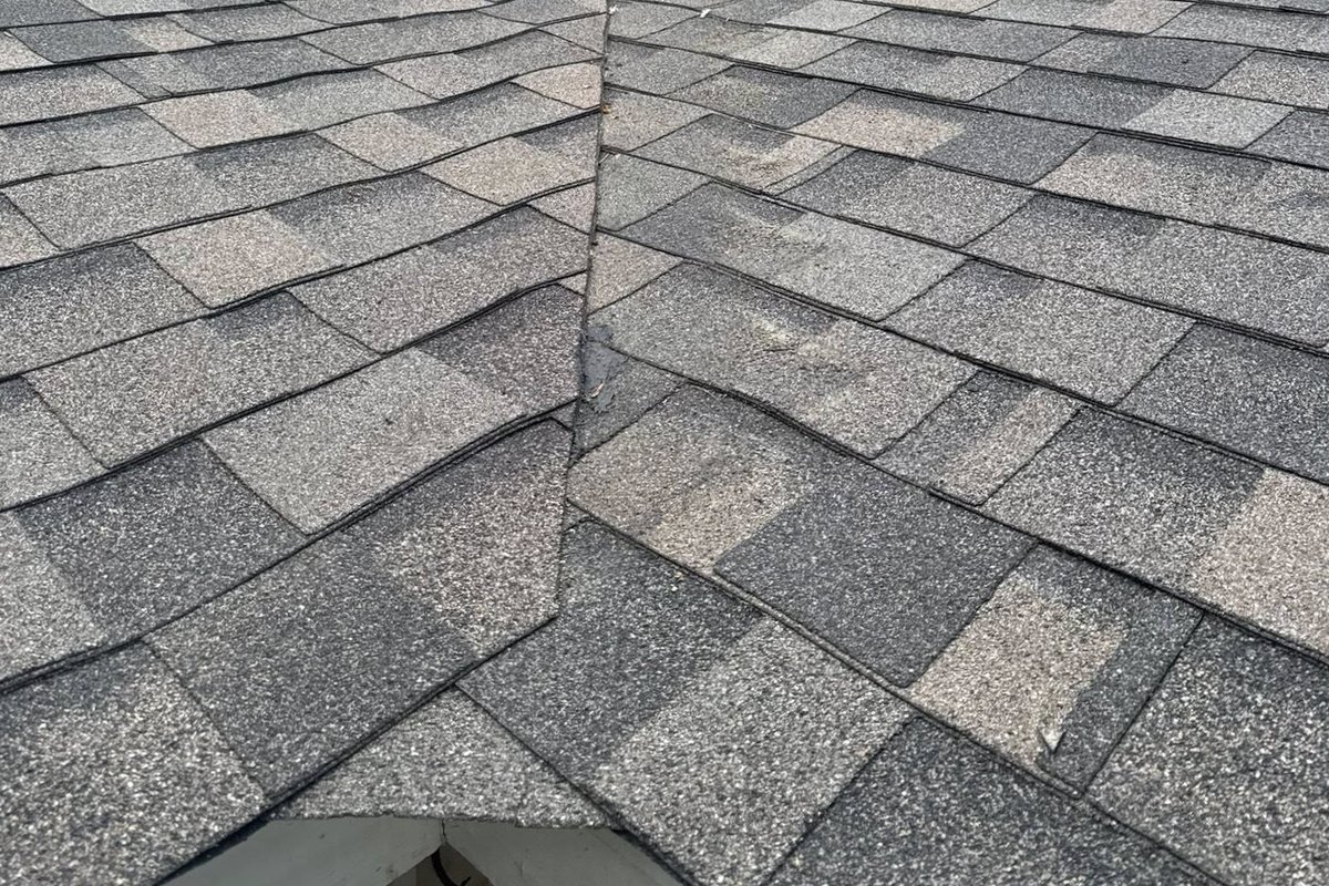 A finished roof valley where two shingle slopes meet